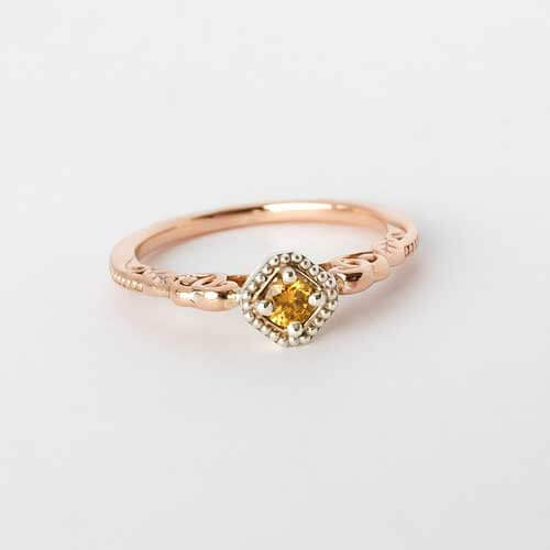 Diamond ring in decorative gold setting