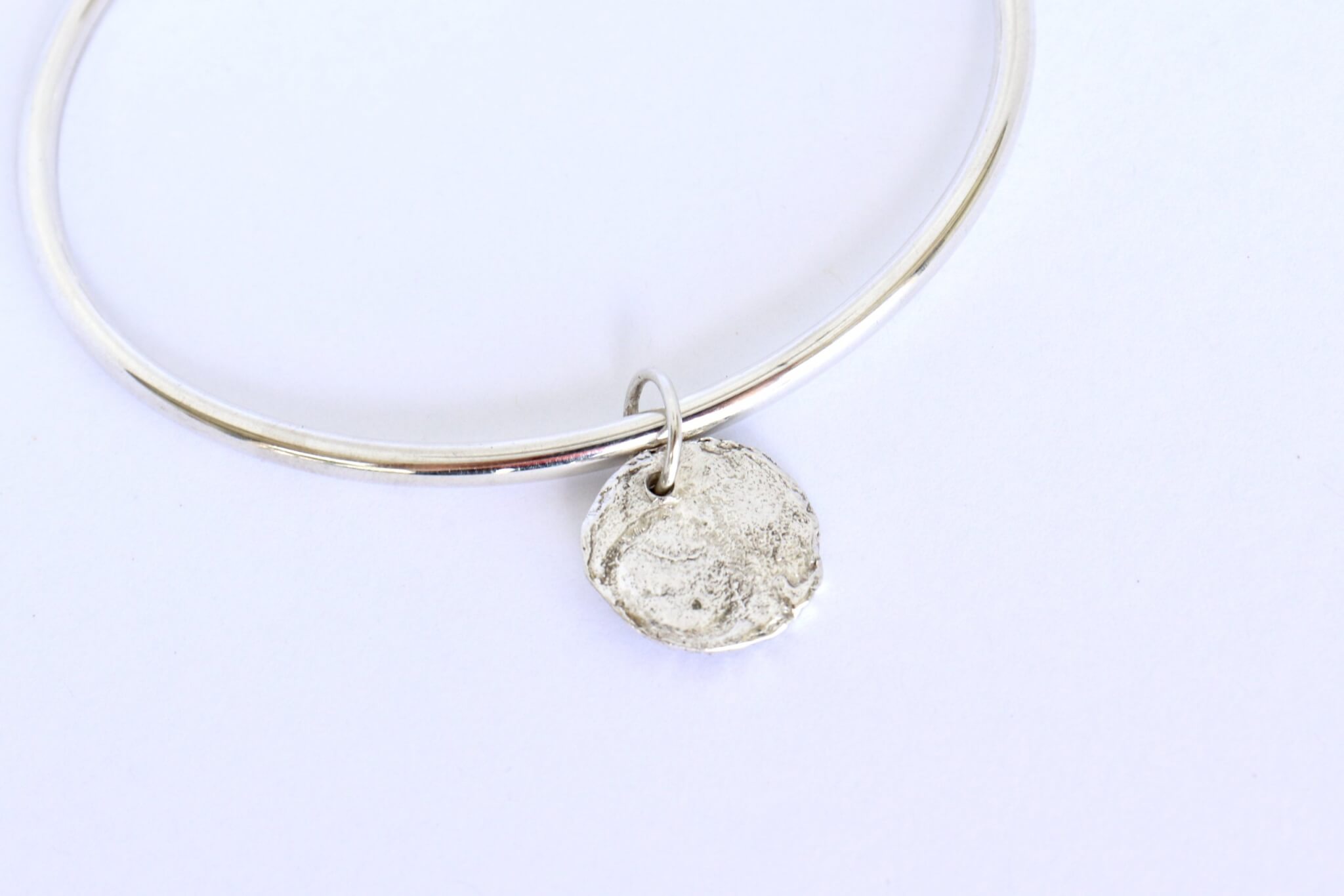 charm-with-ashes